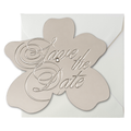 Silver metallic flower-shaped interactive save the date wedding invitation insert featuring elegant embossed script for a luxury wedding invitation suite.